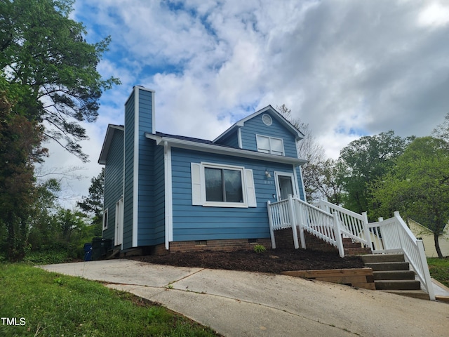 bungalow-style house featuring crawl space and a chimney