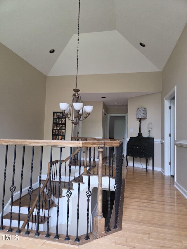 2000 Mountain Laurel Dr, Clayton, NC 27527 - staircase featuring a chandelier, wood finished floors, lofted ceiling, baseboards, and recessed lighting