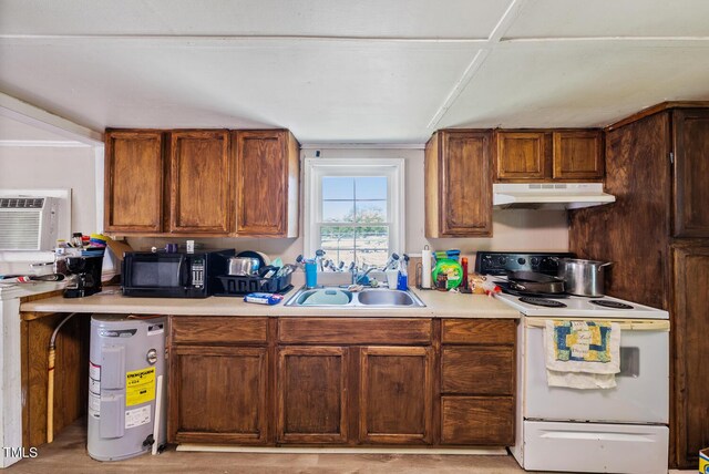 105 E Cole St, Dunn, NC 28334 - kitchen with white range with electric cooktop, under cabinet range hood, a sink, black microwave, and light countertops