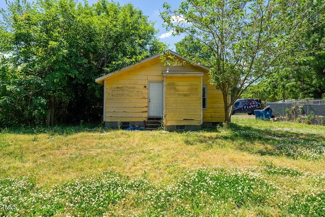 105 E Cole St, Dunn, NC 28334 - view of outdoor structure featuring fence and an outbuilding