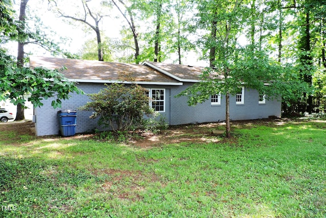 1212 St Marys Rd, Hillsborough, NC 27278 - view of side of property featuring brick siding and a lawn