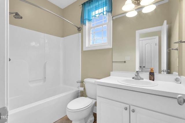 bathroom with toilet,  shower combination, and vanity