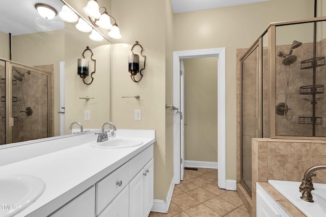 bathroom featuring tile patterned floors, a shower stall, a tub to relax in, and a sink