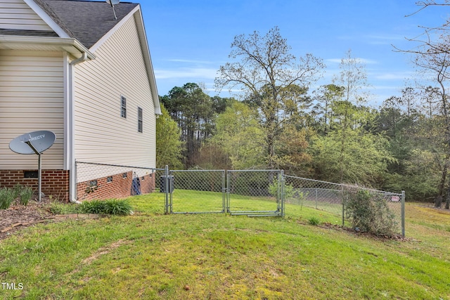 view of yard with a gate and fence