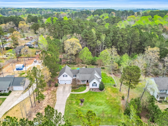 bird's eye view featuring a forest view