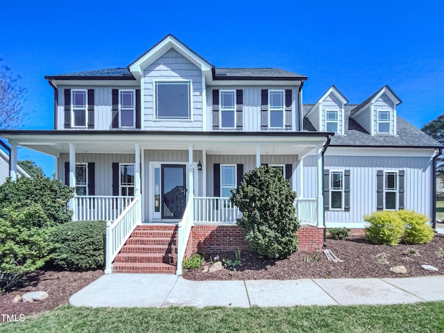 357 Riverwood Dr, Clayton, NC 27527 - view of front facade featuring a shingled roof, a porch, and board and batten siding