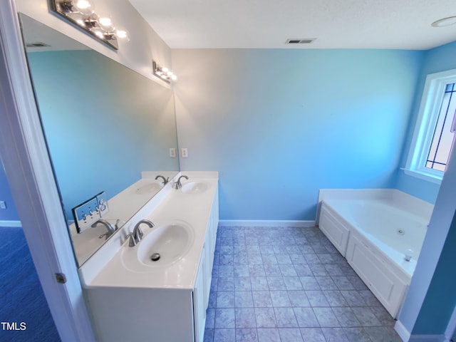 357 Riverwood Dr, Clayton, NC 27527 - bathroom featuring a bath, visible vents, and a sink