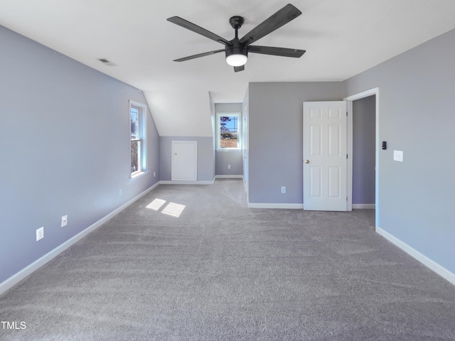 357 Riverwood Dr, Clayton, NC 27527 - interior space with lofted ceiling, carpet, baseboards, visible vents, and ceiling fan