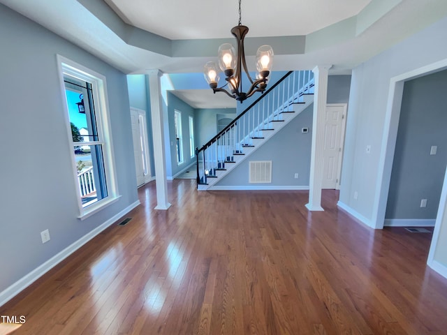 357 Riverwood Dr, Clayton, NC 27527 - interior space featuring visible vents, baseboards, stairs, dark wood finished floors, and an inviting chandelier