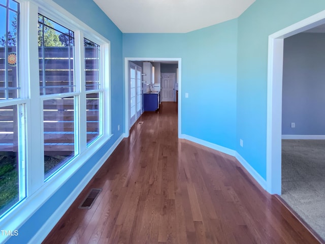 357 Riverwood Dr, Clayton, NC 27527 - hall featuring wood finished floors, baseboards, and visible vents