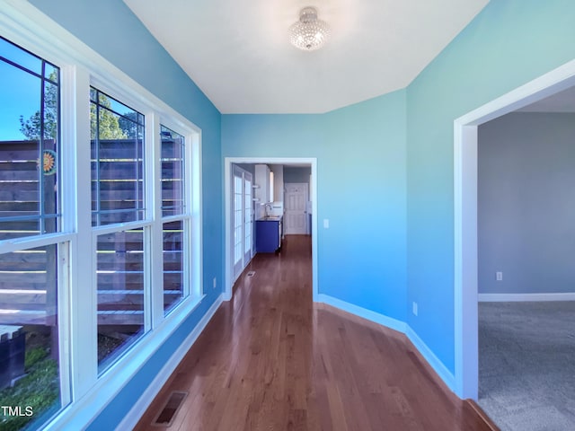 357 Riverwood Dr, Clayton, NC 27527 - hallway featuring baseboards, visible vents, and wood finished floors
