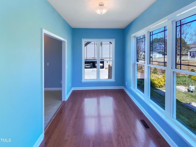 357 Riverwood Dr, Clayton, NC 27527 - empty room with plenty of natural light, baseboards, visible vents, and dark wood-style floors