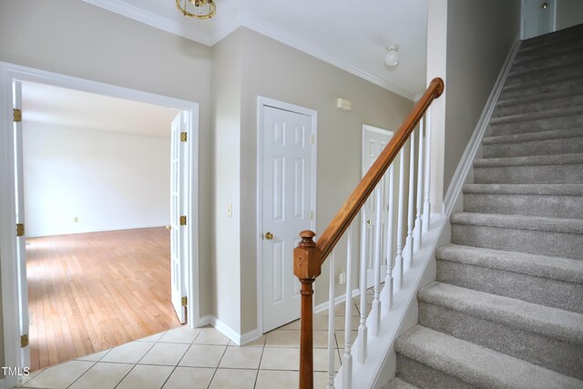 3313 Sparrowhawk Dr, High Point, NC 27265 - staircase with tile patterned floors, crown molding, and baseboards