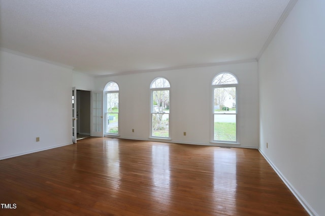 3313 Sparrowhawk Dr, High Point, NC 27265 - spare room featuring wood-type flooring, baseboards, and ornamental molding