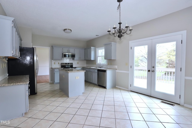 3313 Sparrowhawk Dr, High Point, NC 27265 - kitchen featuring gray cabinets, a kitchen island, visible vents, appliances with stainless steel finishes, and a sink