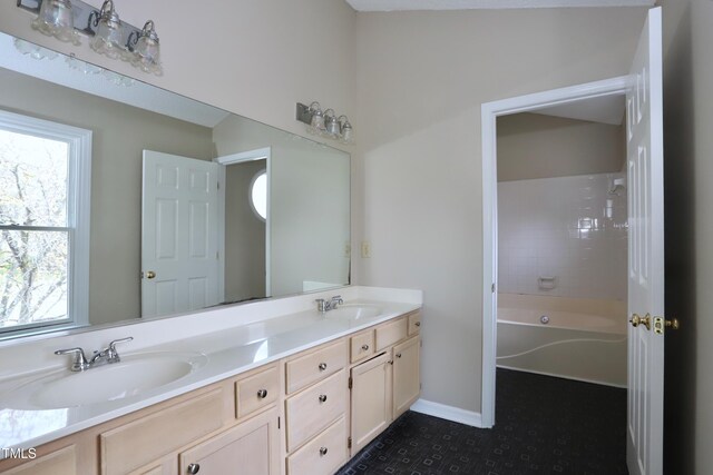 3313 Sparrowhawk Dr, High Point, NC 27265 - full bathroom featuring double vanity, baseboards, and a sink