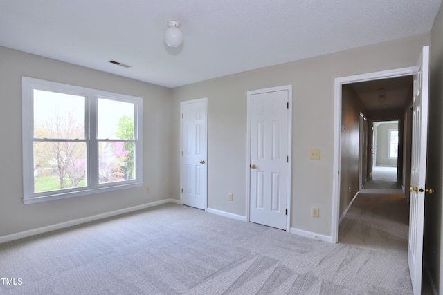 3313 Sparrowhawk Dr, High Point, NC 27265 - unfurnished bedroom featuring baseboards, carpet, and visible vents