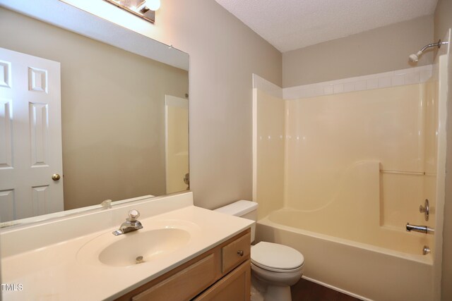 3313 Sparrowhawk Dr, High Point, NC 27265 - full bath featuring toilet, shower / tub combination, vanity, and a textured ceiling