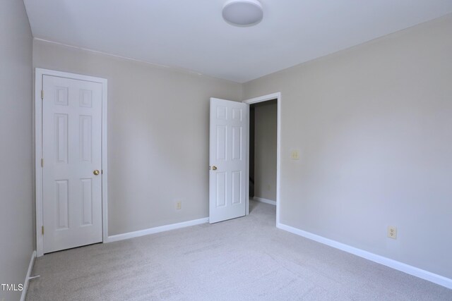 3313 Sparrowhawk Dr, High Point, NC 27265 - unfurnished bedroom featuring baseboards and carpet