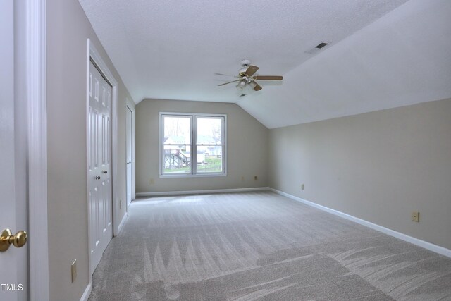 3313 Sparrowhawk Dr, High Point, NC 27265 - bonus room featuring ceiling fan, visible vents, vaulted ceiling, carpet flooring, and baseboards