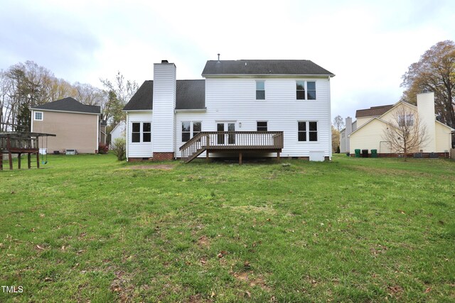 3313 Sparrowhawk Dr, High Point, NC 27265 - rear view of property featuring a deck, a chimney, and a lawn