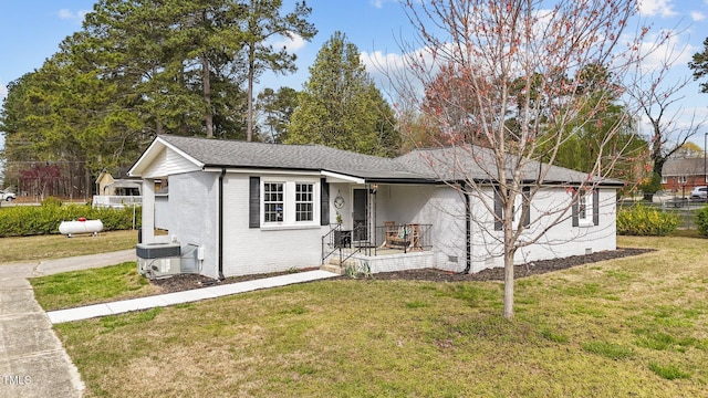 116 Lakewood Dr, Wendell, NC 27591 - single story home featuring brick siding, a front yard, central AC unit, and roof with shingles