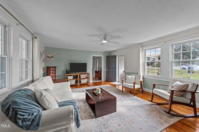 116 Lakewood Dr, Wendell, NC 27591 - living area featuring baseboards, wood finished floors, ceiling fan, and a textured ceiling