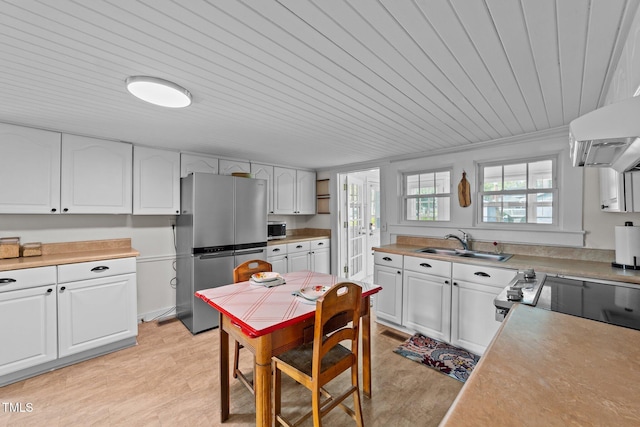 116 Lakewood Dr, Wendell, NC 27591 - kitchen with french doors, stainless steel appliances, a sink, wood ceiling, and white cabinets