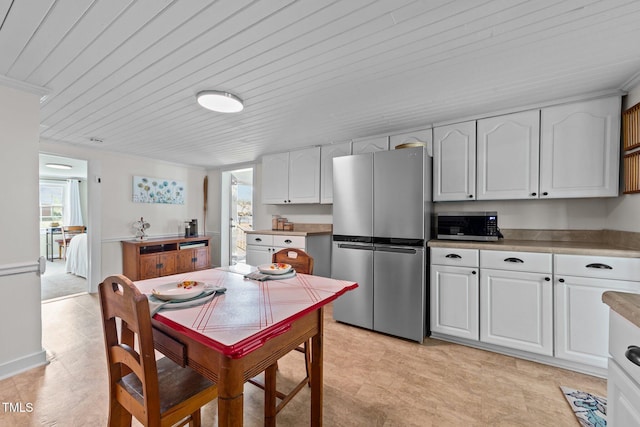 116 Lakewood Dr, Wendell, NC 27591 - kitchen featuring light countertops, white cabinets, wooden ceiling, and appliances with stainless steel finishes