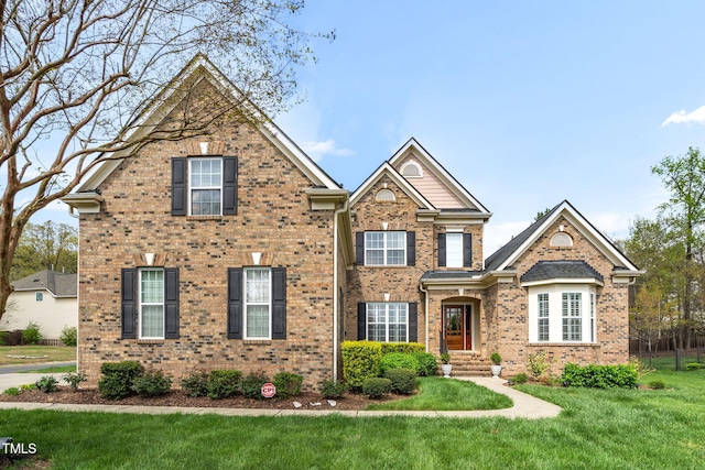 1808 Pattersons Mill Rd, Durham, NC 27703 - traditional-style home with brick siding and a front lawn