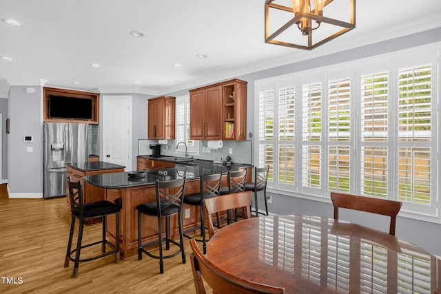 1808 Pattersons Mill Rd, Durham, NC 27703 - dining space with light wood-type flooring, baseboards, ornamental molding, and plenty of natural light