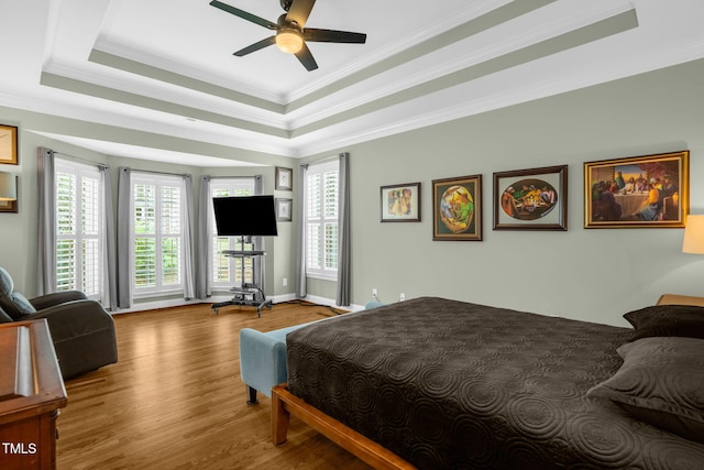 1808 Pattersons Mill Rd, Durham, NC 27703 - bedroom featuring baseboards, ornamental molding, a raised ceiling, ceiling fan, and wood finished floors