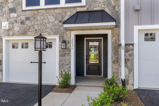 doorway to property featuring stone siding