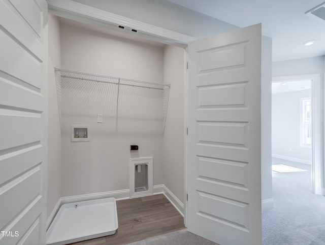 clothes washing area with baseboards, visible vents, laundry area, and hookup for a washing machine