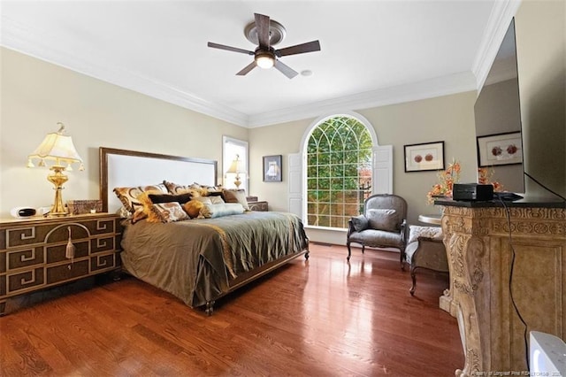 bedroom with crown molding and wood finished floors