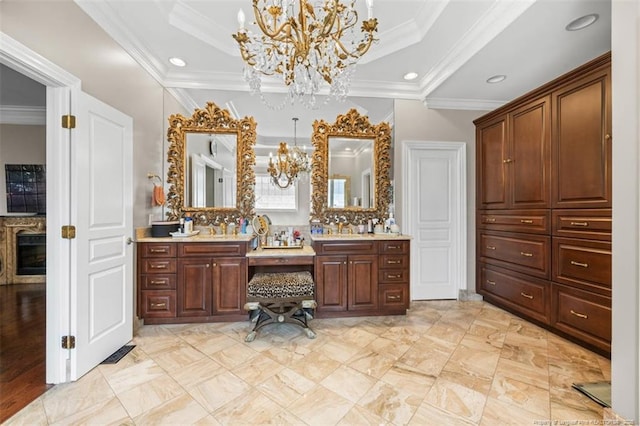 full bath with vanity, backsplash, a notable chandelier, and a raised ceiling
