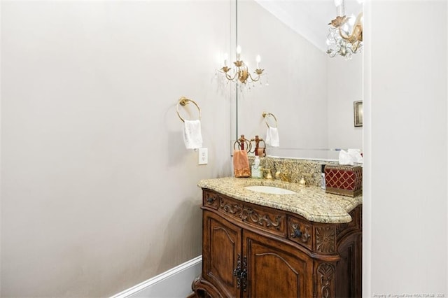 bathroom featuring baseboards and vanity