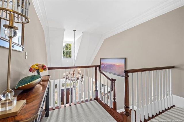 staircase featuring an inviting chandelier, ornamental molding, and baseboards