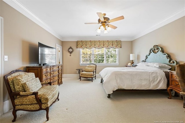 carpeted bedroom with baseboards, crown molding, and ceiling fan