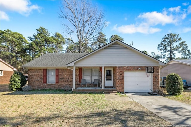 ranch-style home featuring a garage, a front yard, brick siding, driveway, and a porch
