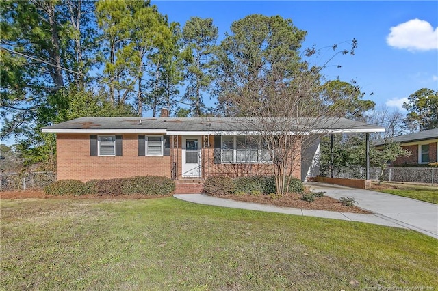 3722 Sandra Dr, Fayetteville, NC 28304 - ranch-style house with fence, driveway, a front yard, brick siding, and a carport