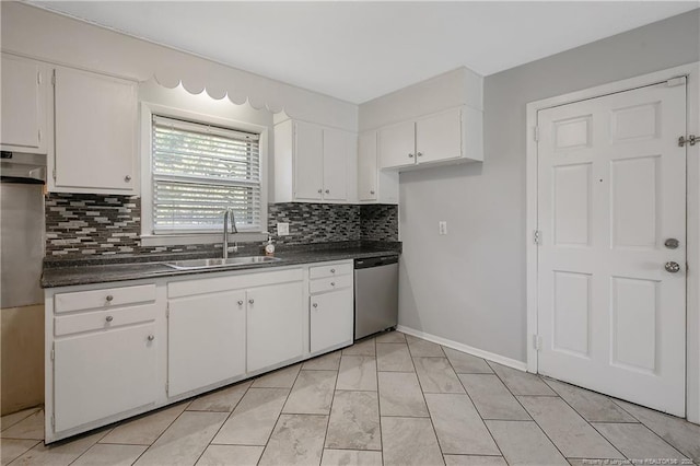 3722 Sandra Dr, Fayetteville, NC 28304 - kitchen with a sink, dark countertops, dishwasher, and white cabinetry