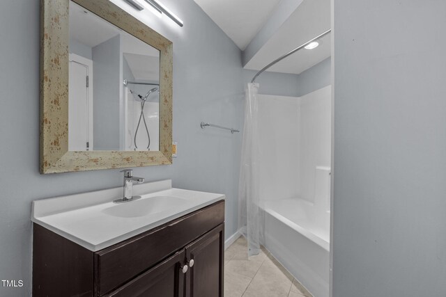 full bath featuring vanity, tile patterned flooring, and shower / tub combo with curtain