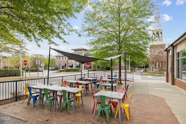 view of patio / terrace with outdoor dining space and fence
