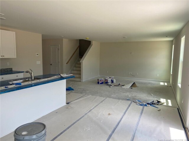 4894 Blue Springs Rd, Red Springs, NC 28377 - kitchen with a sink, white cabinetry, and healthy amount of natural light