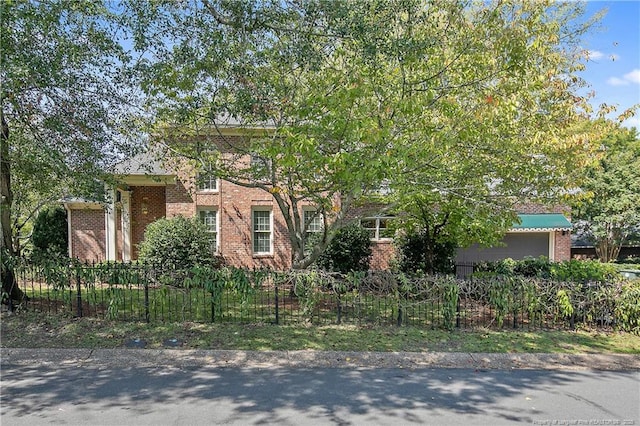 1800 Pugh St, Fayetteville, NC 28305 - view of front facade featuring brick siding and a fenced front yard