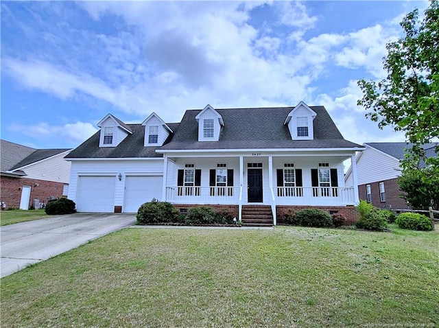 new england style home with a garage, concrete driveway, crawl space, a front lawn, and covered porch