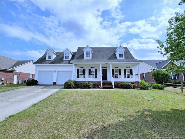 cape cod home featuring a front lawn, covered porch, an attached garage, and concrete driveway