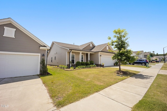 view of front of house featuring concrete driveway, a front lawn, and a garage
