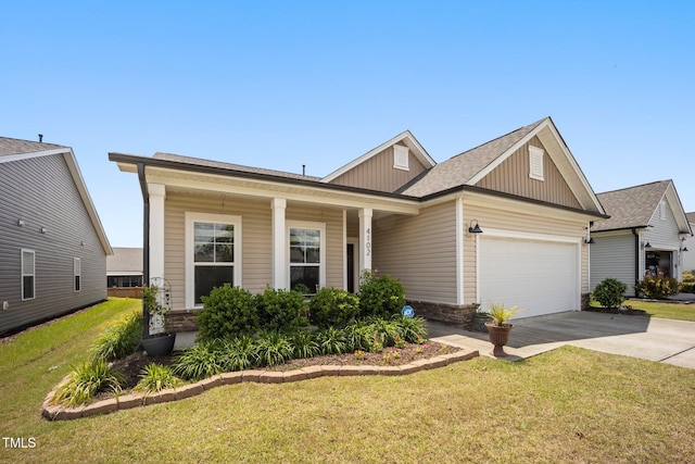view of front facade featuring board and batten siding, a garage, concrete driveway, a front yard, and covered porch
